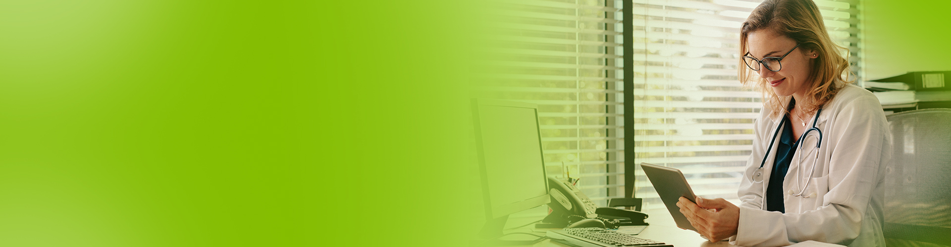 Doctor looking at a tablet - Netsmart care coordination software improves quality of care